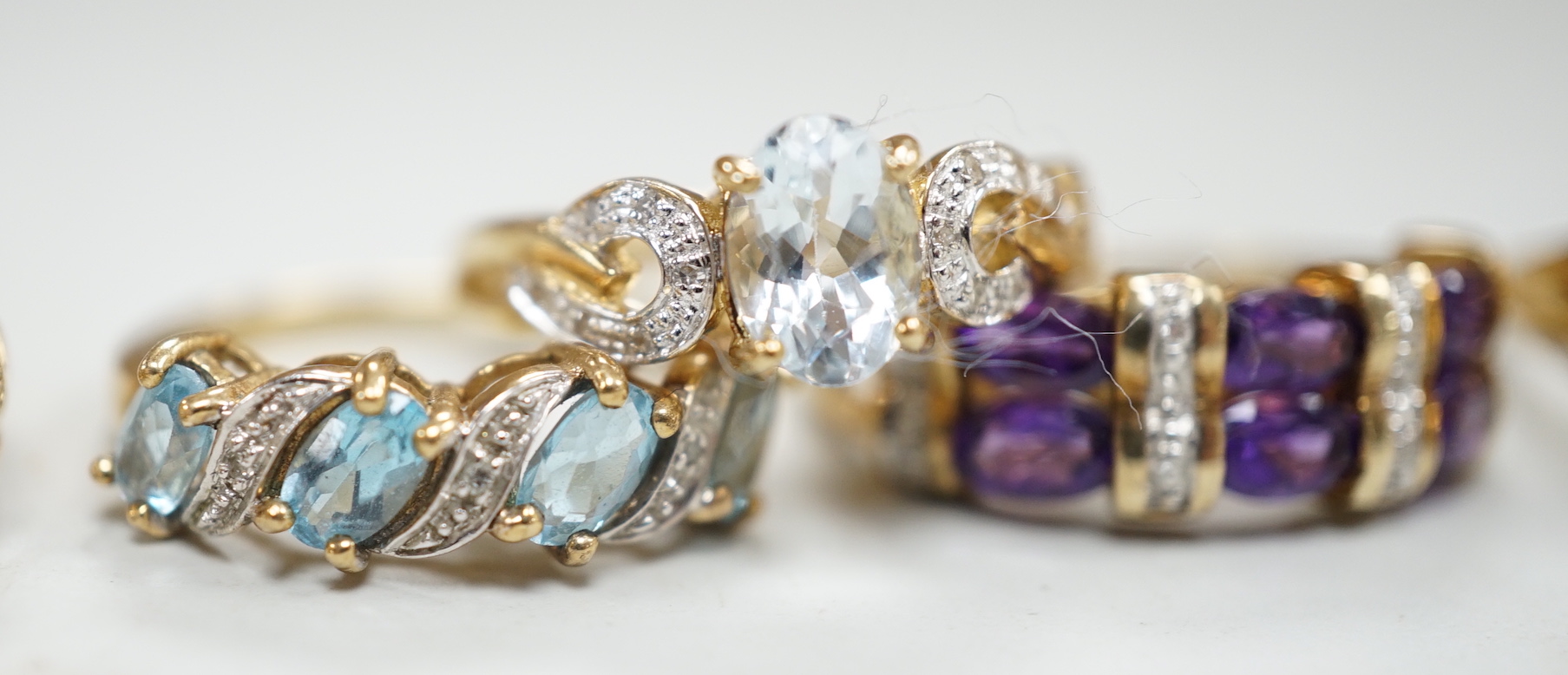 Five assorted modern 9ct gold and gem set dress rings, including citrine and diamond and amethyst and diamond, gross weight 14.8 grams.